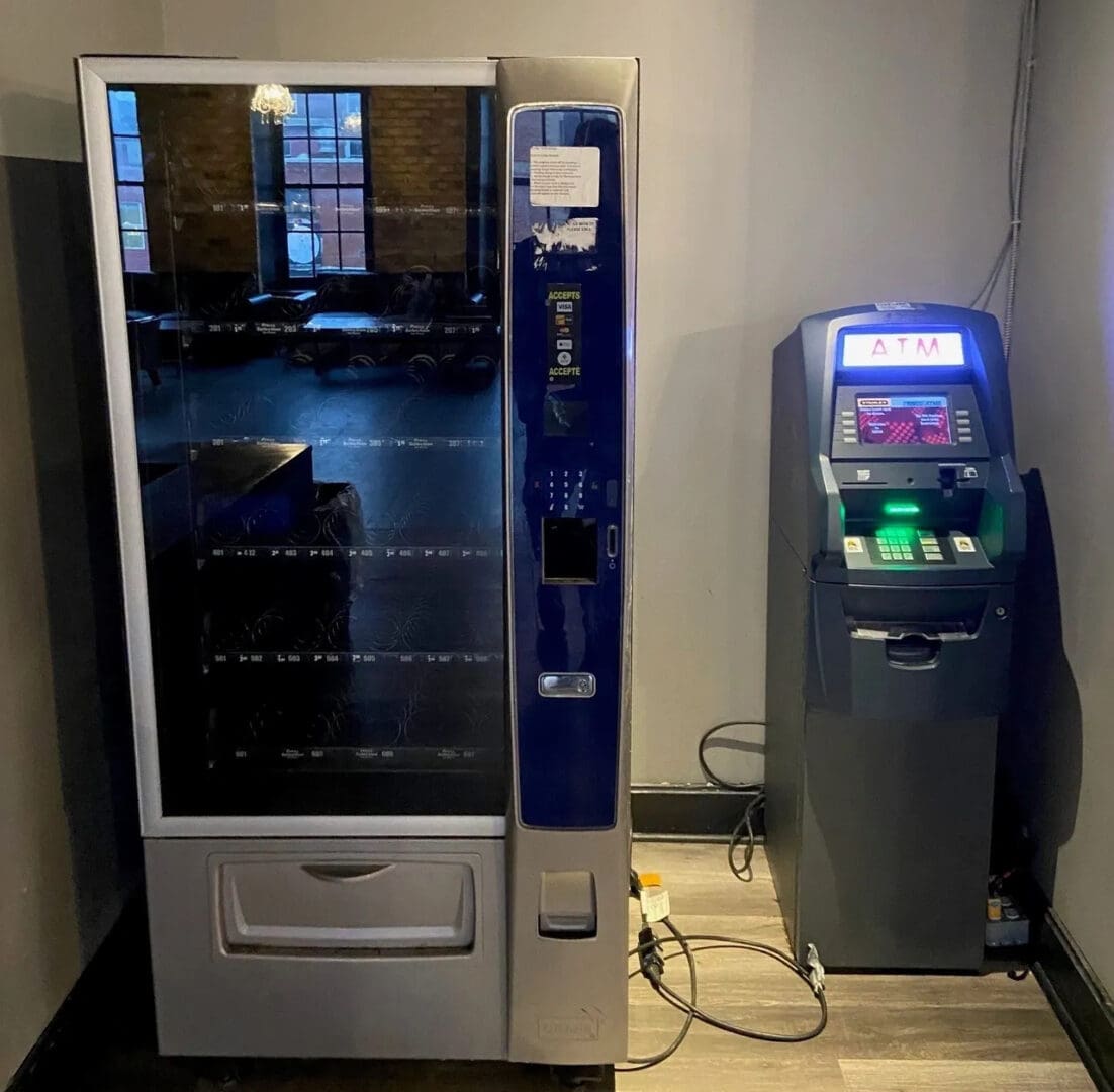 A vending machine and atm are shown in this image.