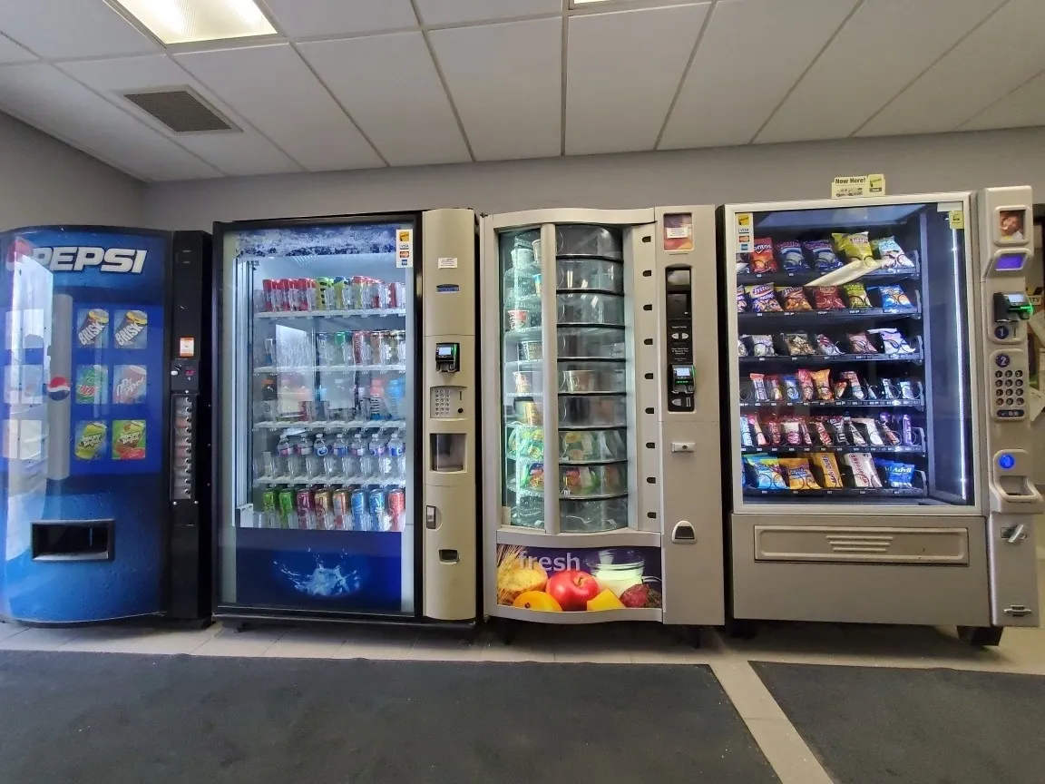 A row of vending machines in an office building.